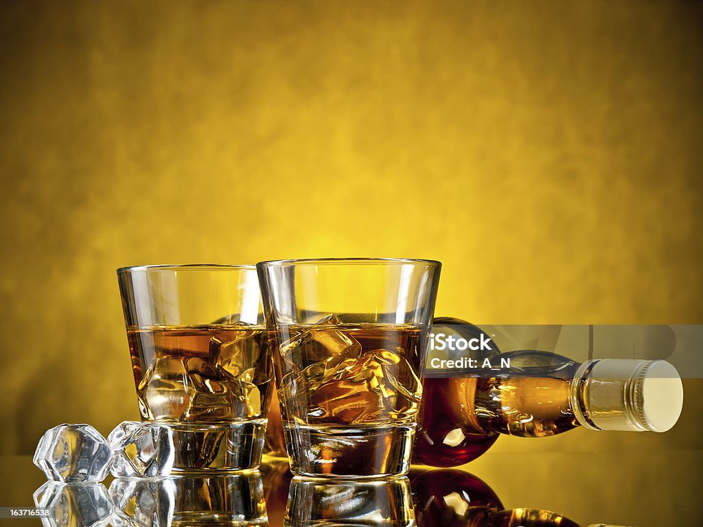 Two drinks Bottle of whiskey and two whiskeys on the rocks Alcohol - Drink Stock Photo