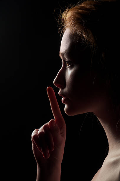 istock Young Woman Gesturing For Being Quiet 163720594