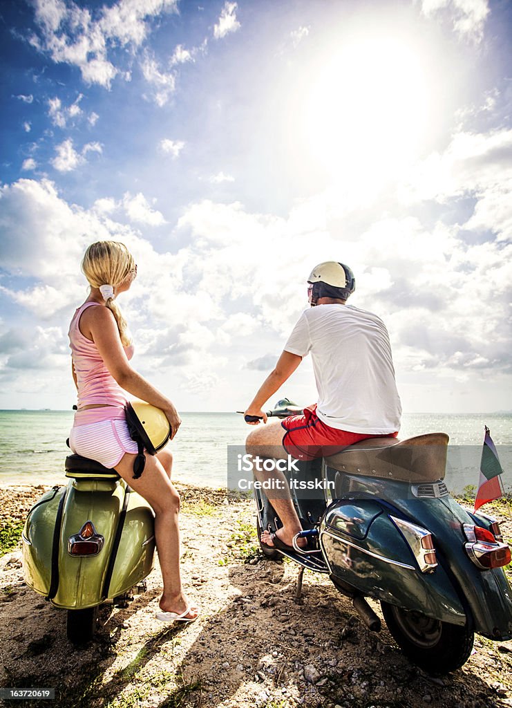 Couple on the beach with retro bikes Romantic couple with retro bikes on vacation Beach Stock Photo