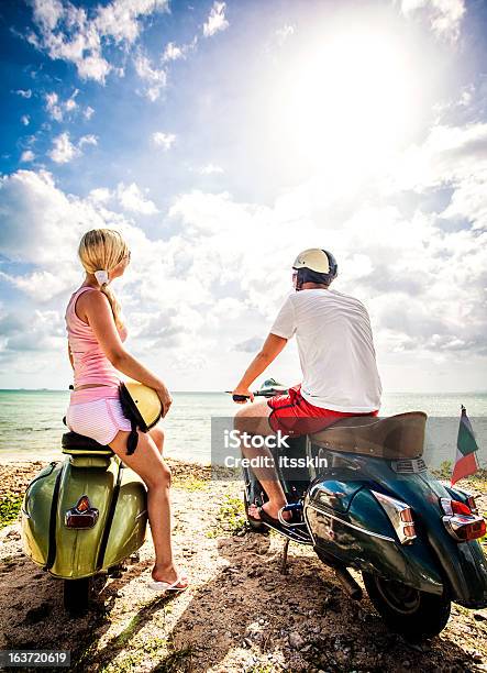 Couple On The Beach With Retro Bikes Stock Photo - Download Image Now - Beach, People, Tropical Climate