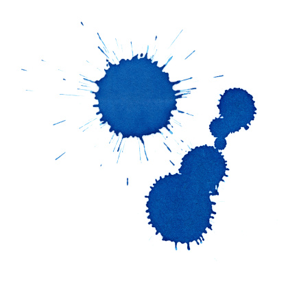 Isolated blue ink splatter drops close-up