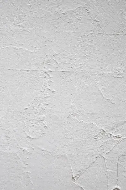 Photo of Textured Tranquility: Close-Up of White Plaster Wall for Backgrounds