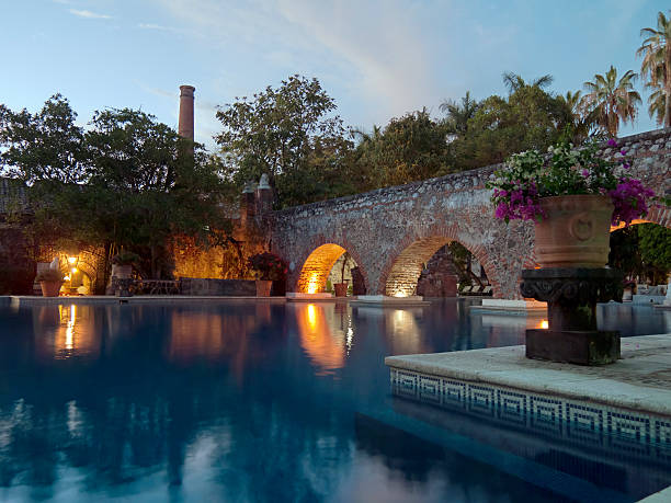 Hotel Swimming Pool Mexico The ruins of old buildings have been transformed into a luxurious swimming pool at an old hacienda in Cuernavaca, Mexico. morelos state stock pictures, royalty-free photos & images