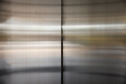stainless steel elevator door background and texture, silver metal wall panel.