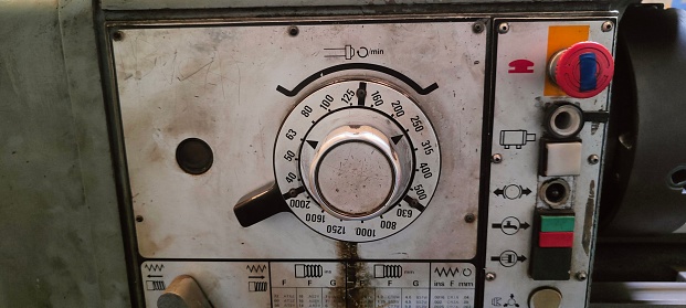 Bogor, Indonesia - August 25, 2023 : A button and selector are mounted on a machine panel