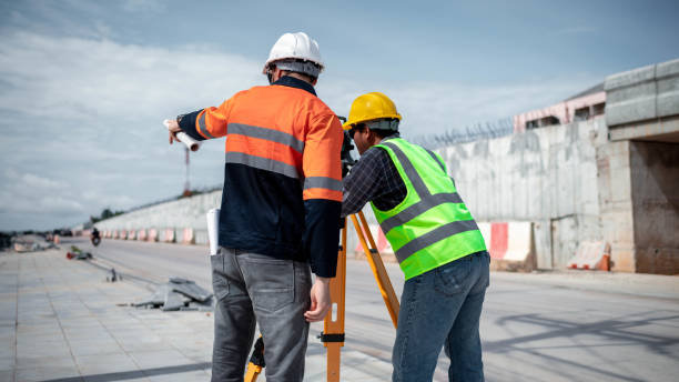 istock Engineer surveyor wearing uniform conversation and check inspection by theodolite camera to measurement level position road construction site is industry transportation concept 1637255113