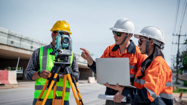 istock Engineer surveyor wearing uniform conversation and check inspection by theodolite camera to measurement level position road construction site is industry transportation concept 1637255114