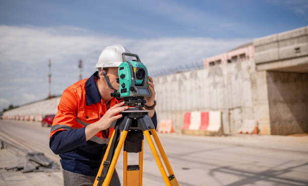 istock Engineer surveyor wearing uniform conversation and check inspection by theodolite camera to measurement level position road construction site is industry transportation concept 1637255128