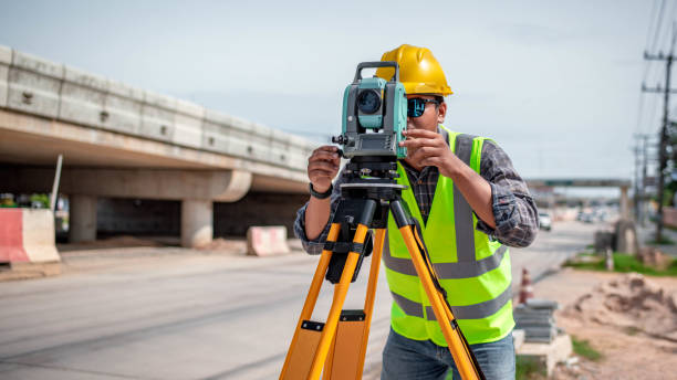 istock Engineer surveyor wearing uniform conversation and check inspection by theodolite camera to measurement level position road construction site is industry transportation concept 1637255133