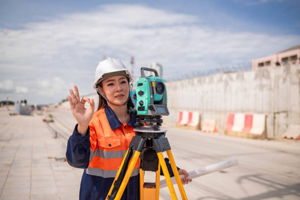 istock Engineer surveyor wearing uniform conversation and check inspection by theodolite camera to measurement level position road construction site is industry transportation concept 1637255143