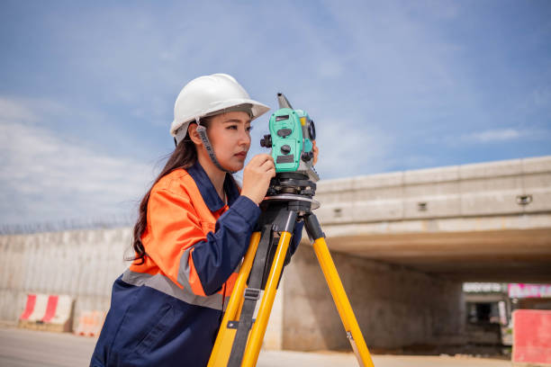 istock Engineer surveyor wearing uniform conversation and check inspection by theodolite camera to measurement level position road construction site is industry transportation concept 1637255155