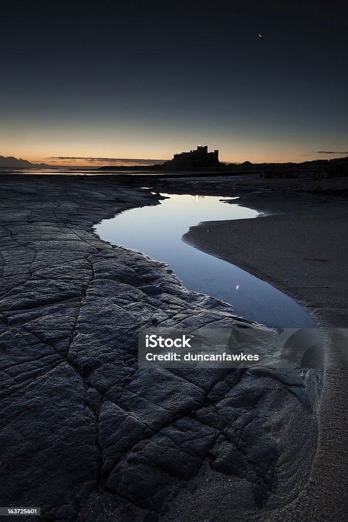 Bamburgh amanhecer - Foto de stock de Areia royalty-free