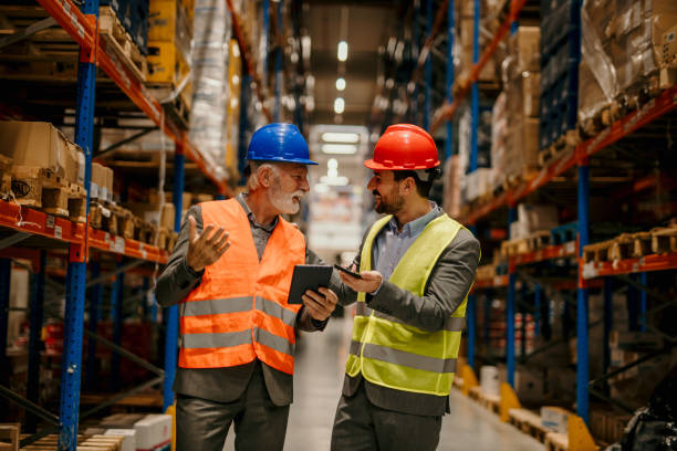 istock Capture the atmosphere of the warehouse during a night shift, with workers using artificial lighting to carry out tasks efficiently. 1637275801