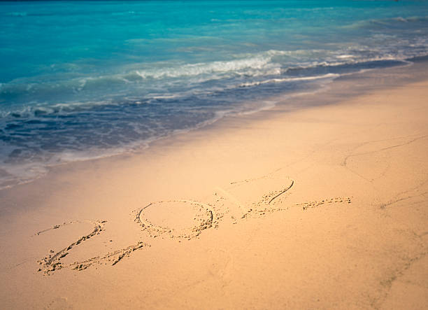 istock New year 2012 in the sand beach 163727924
