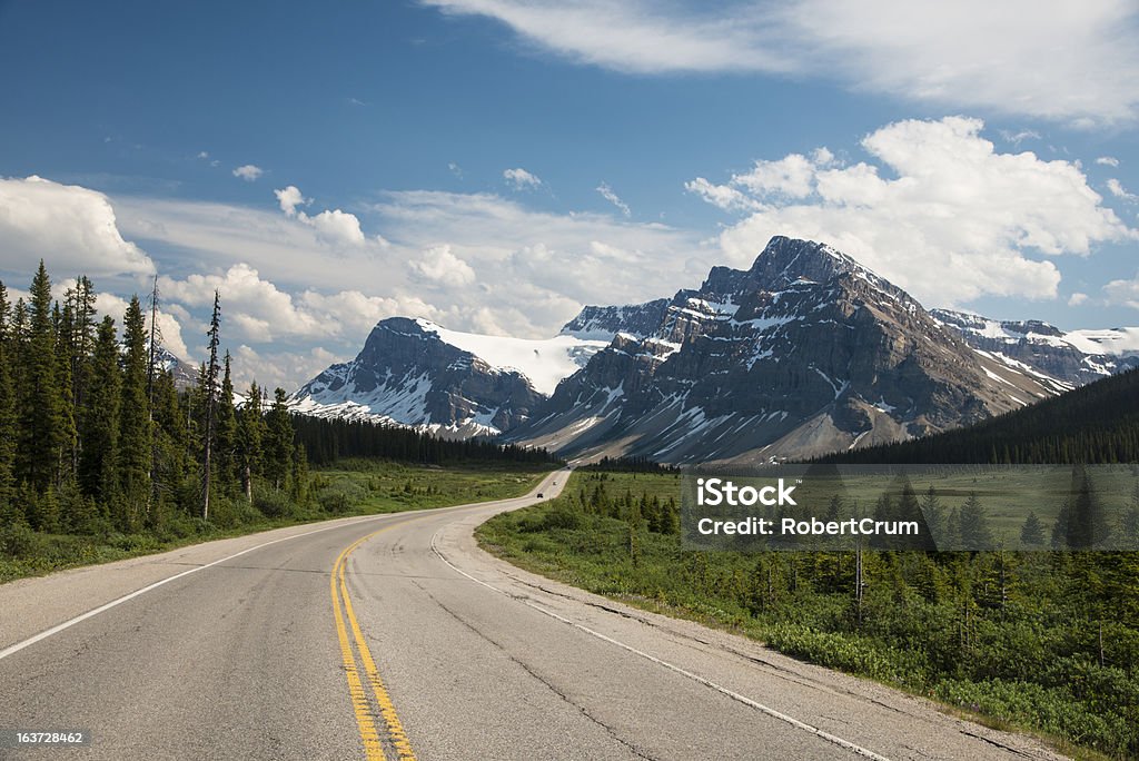 Highway passing below mountains Highway passing below the Canadian Rockies, Banff National Park, Alberta Alberta Stock Photo
