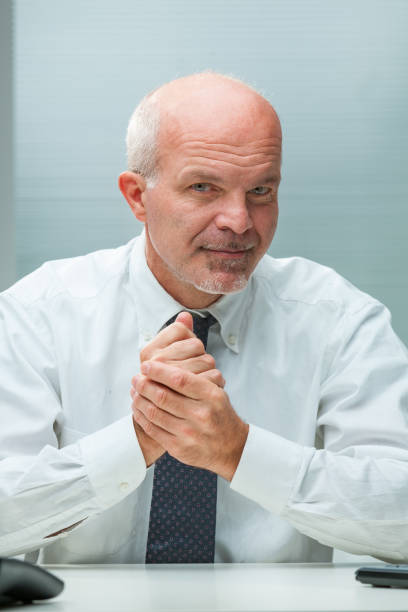 istock Rubbing hands, wily grin, intrigues influence economy 1637291119
