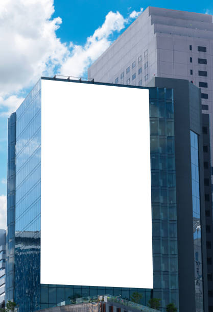 istock Mock up white large LED display vertical billboard on tower building .clipping path for mockup 1637292150
