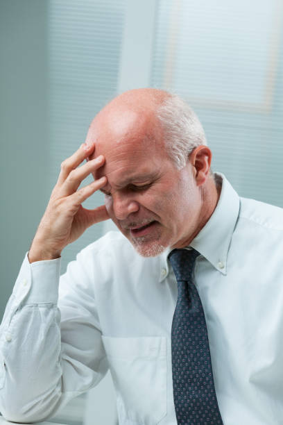 istock Mature man agonizes, frustration, self-disappointment evident 1637292151