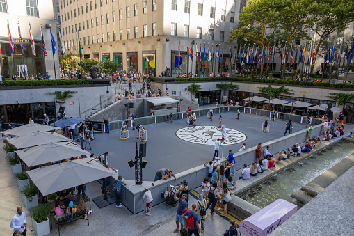 People enjoy the roller rink at the Rockefeller Center in New York City.