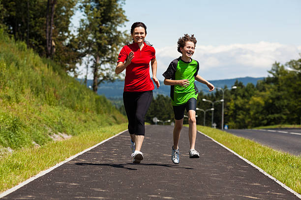 istock Mother with kid running outdoor 163729444