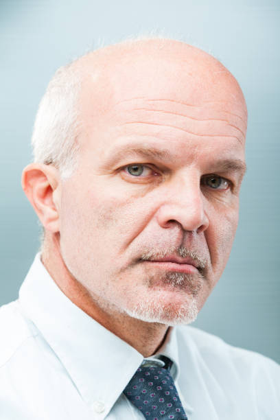 istock Confident man, white-templed, displays integrity, expertise 1637295857