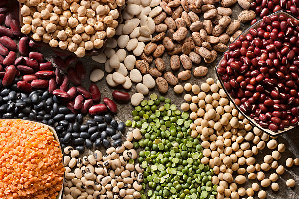 An up close picture of organic legumes Piles of a variety of healthy organic legumes. Lentils stock pictures, royalty-free photos & images