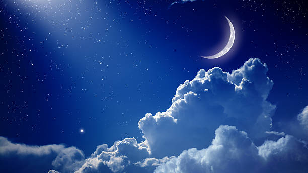 istock A beautiful night with a blue sky, the moon, and clouds 163730354
