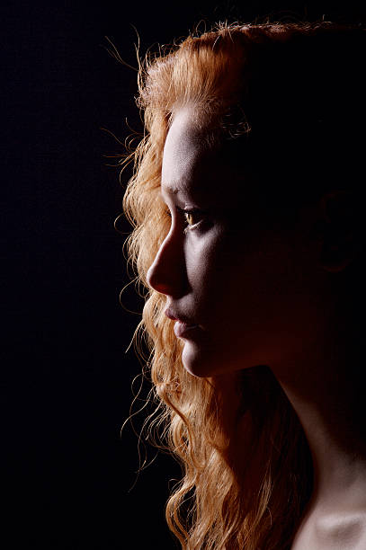 istock profile of young pensive woman 163730433