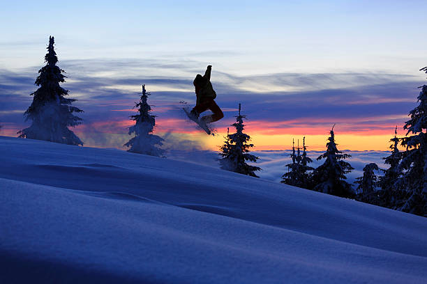 istock Freestyle snowboarder in a jump 163732249