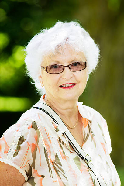istock Senior woman with white hair smiling 163732328
