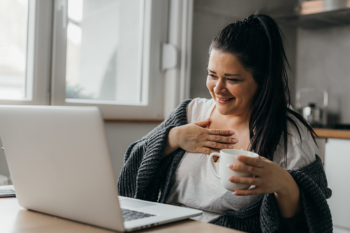 Happy caucasian woman is having a video call