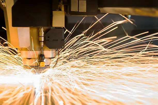 Photo of High-tech metal CNC, cutting laser tool in use.