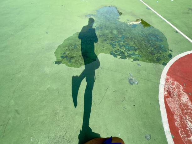 istock the shadow of people in various poses on the floor 1637354471