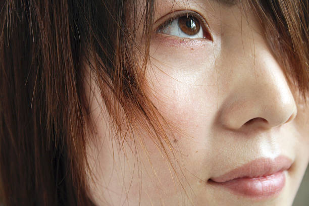 istock Young Chinese Woman Looking Up 163735865