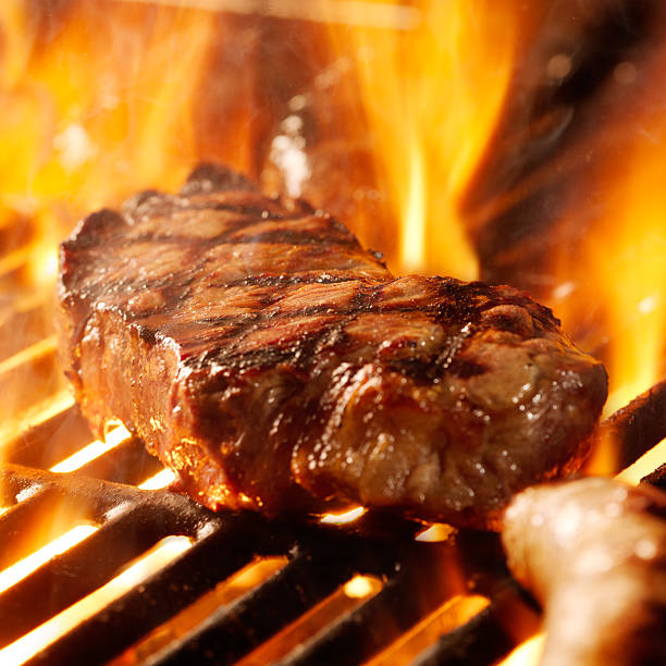 istock beef steak on the grill with flames 163736391