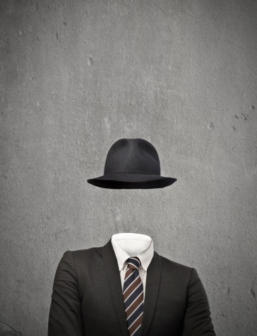 invisible businessman with hat on gray background