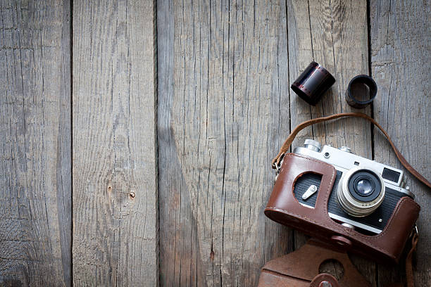 istock Old retro camera on vintage wooden boards 163736573