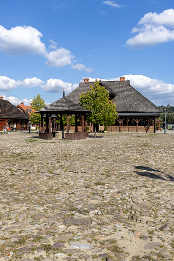 Nowy Sacz, Poland - August 30, 2022: Reconstruction of Galician small town from the turn of the 19th and 20th centuries, wooden houses, market square and town hall, Sadecki Ethnographic Park