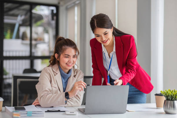 istock Two business women are discussing and exchanging knowledge on graphs and finance data. 1637388026