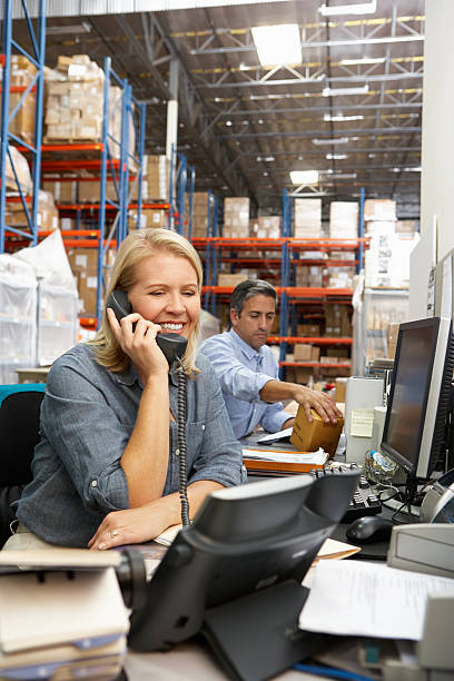 istock Businesswoman Working At Desk In Warehouse 163739905