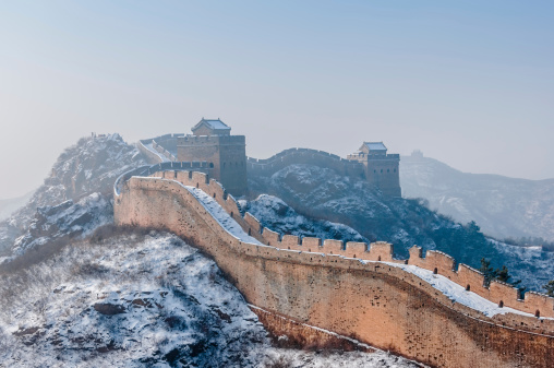 Jinshanling great wall showing the battlement and fogy tower on background, shot in winter season.