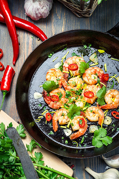 istock Shrimps served on a pan with chilli pepper 163744202