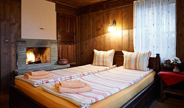 istock Guest house bedroom with fireplace 163744936