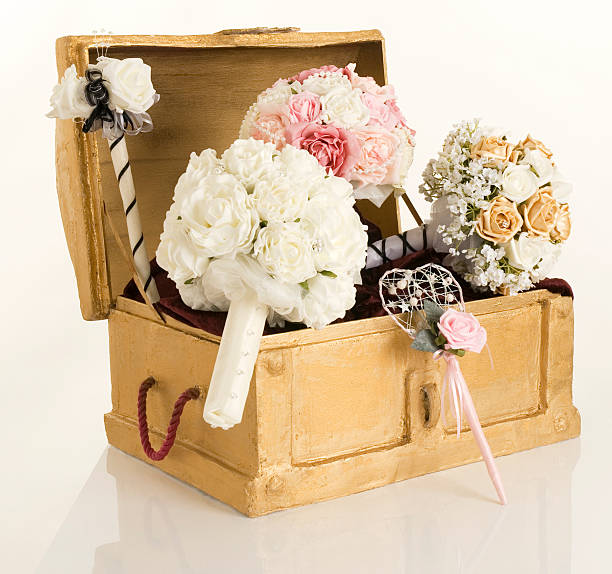 istock gold treaure chest with silk flowers 163747187