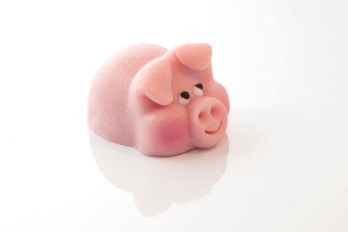 pink marzipan pig on the white background