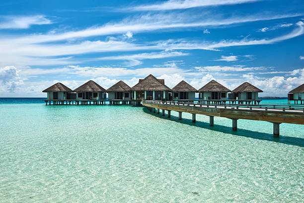 istock Beautiful beach with water bungalows 163747637
