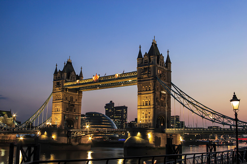 Illuminated Tower Bridge over the Thames in the evening, London, England, United Kingdom, Europe