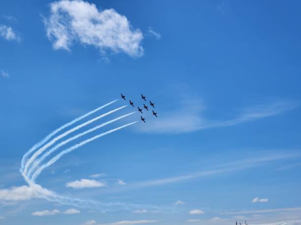 istock a few planes are flying in the sky together and leaving trails 1637485449