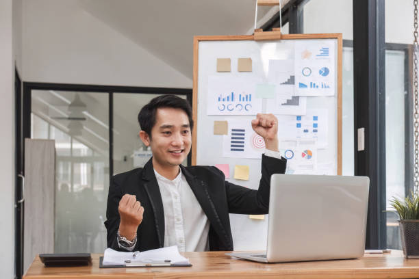 istock Businessman is happy that his business is successful. 1637487051