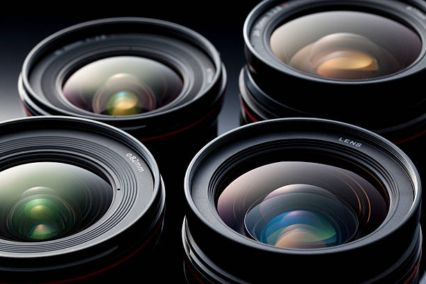 Multiple camera lenses, reflective lenses Camera lens isolated on black digital camera photos stock pictures, royalty-free photos & images